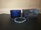 Pisces zodiac candle with gemstone bracelet and Ancient Wisdom gift box